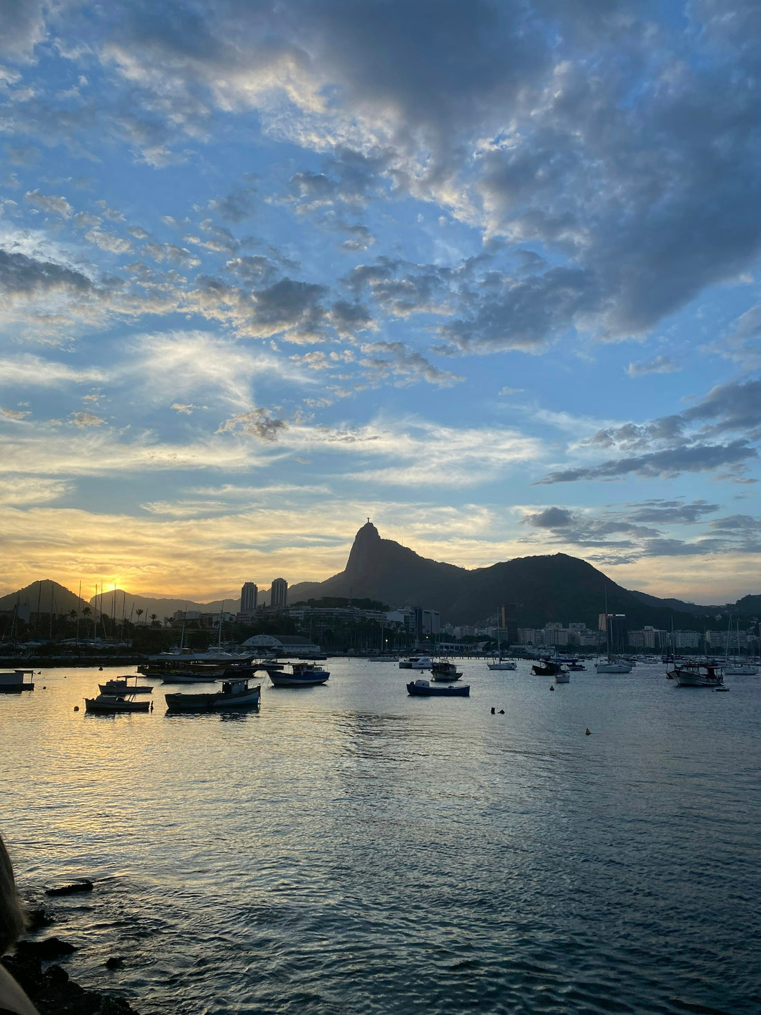 Boats on Botafogo bay at sunset, with Corcovado and Christ the Redeemer in the background