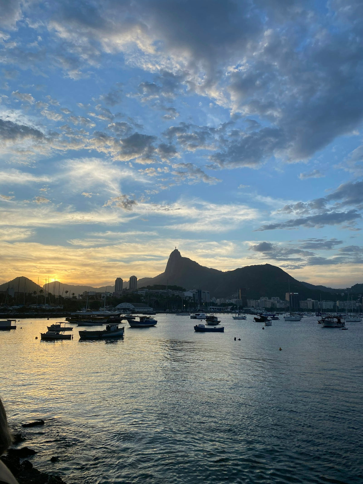 Boats on Botafogo bay at sunset, with Corcovado and Christ the Redeemer in the background